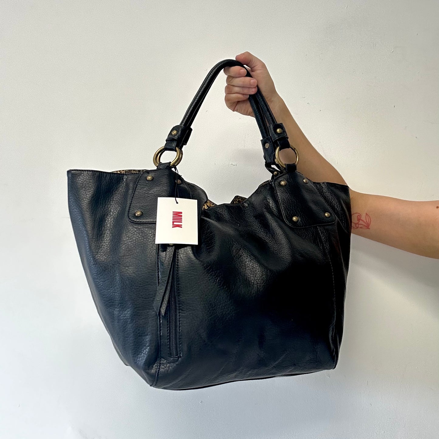 black faux leather single zip shoulder bag