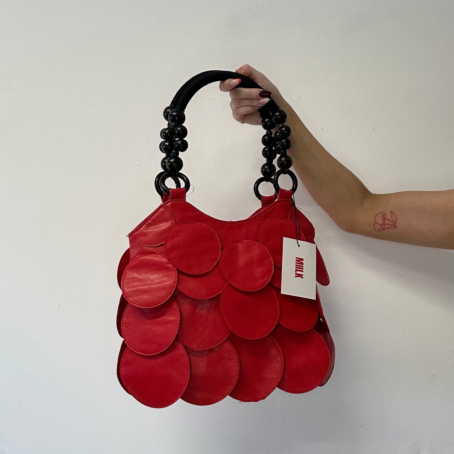 red faux leather disc beaded shoulder bag