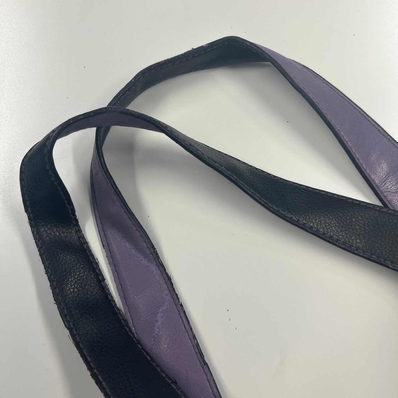 black and purple k faux leather shoulder bag