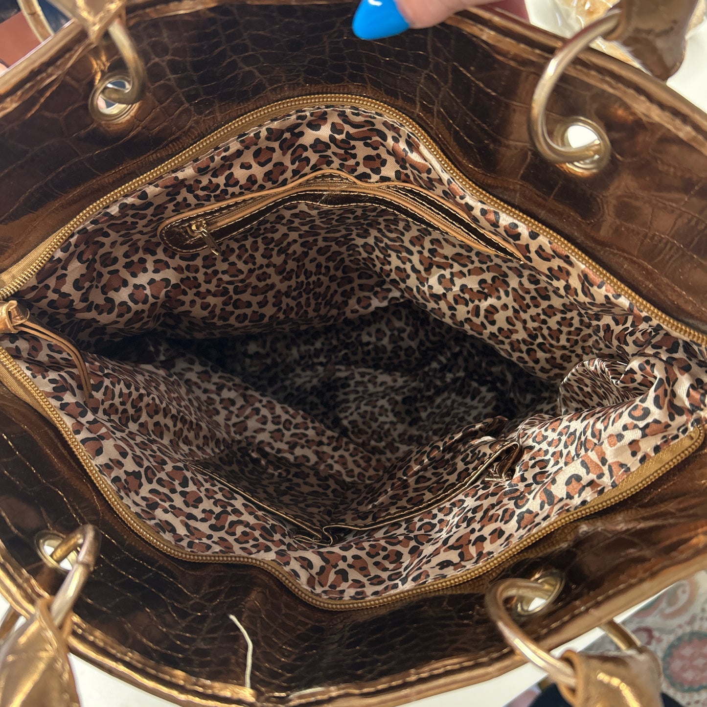 gold and bronze studded croc effect hand bag