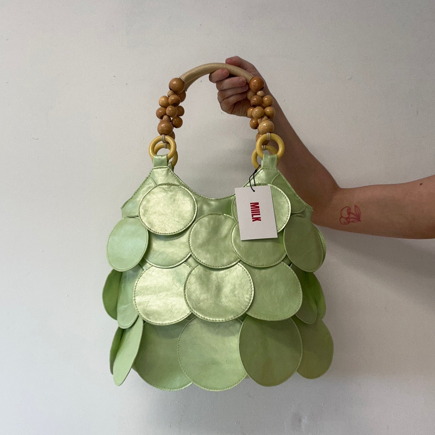 mint green faux leather disc beaded shoulder bag