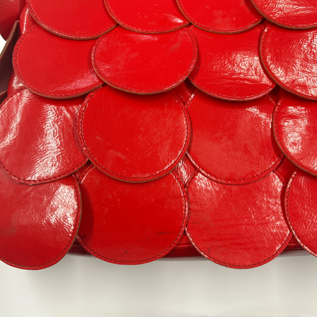 red faux leather disc beaded shoulder bag