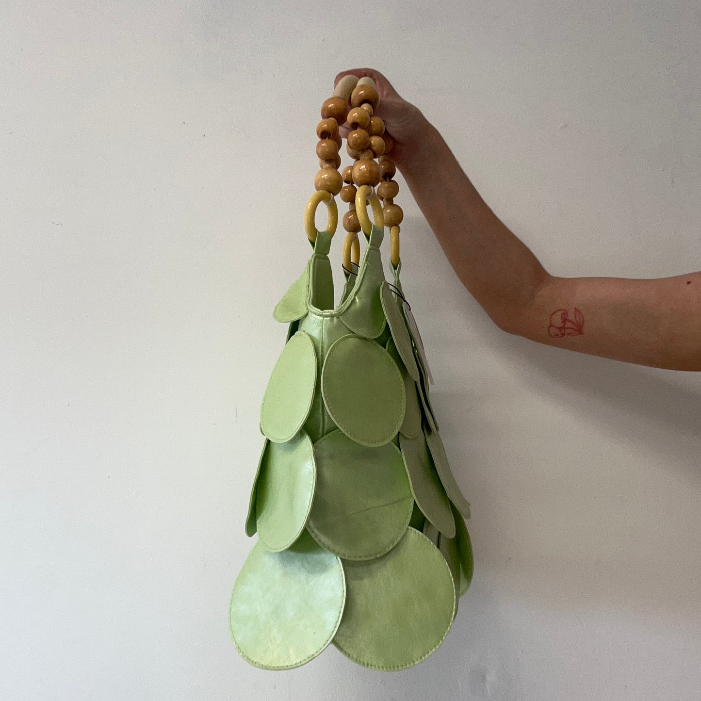 mint green faux leather disc beaded shoulder bag