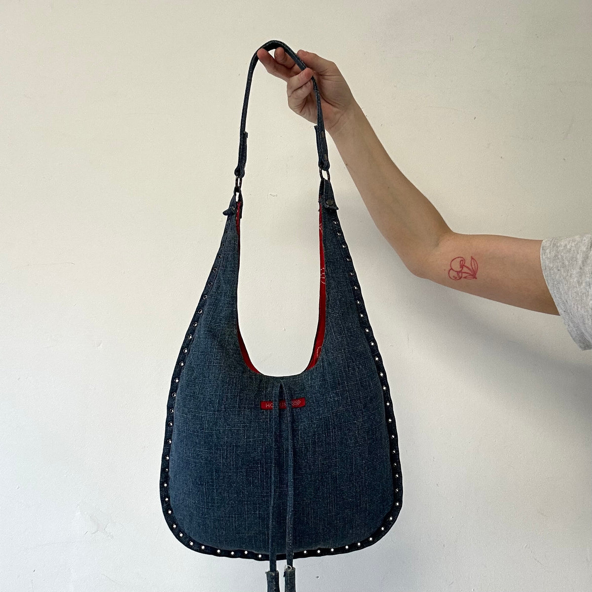 blue denim eyelet shoulder bag