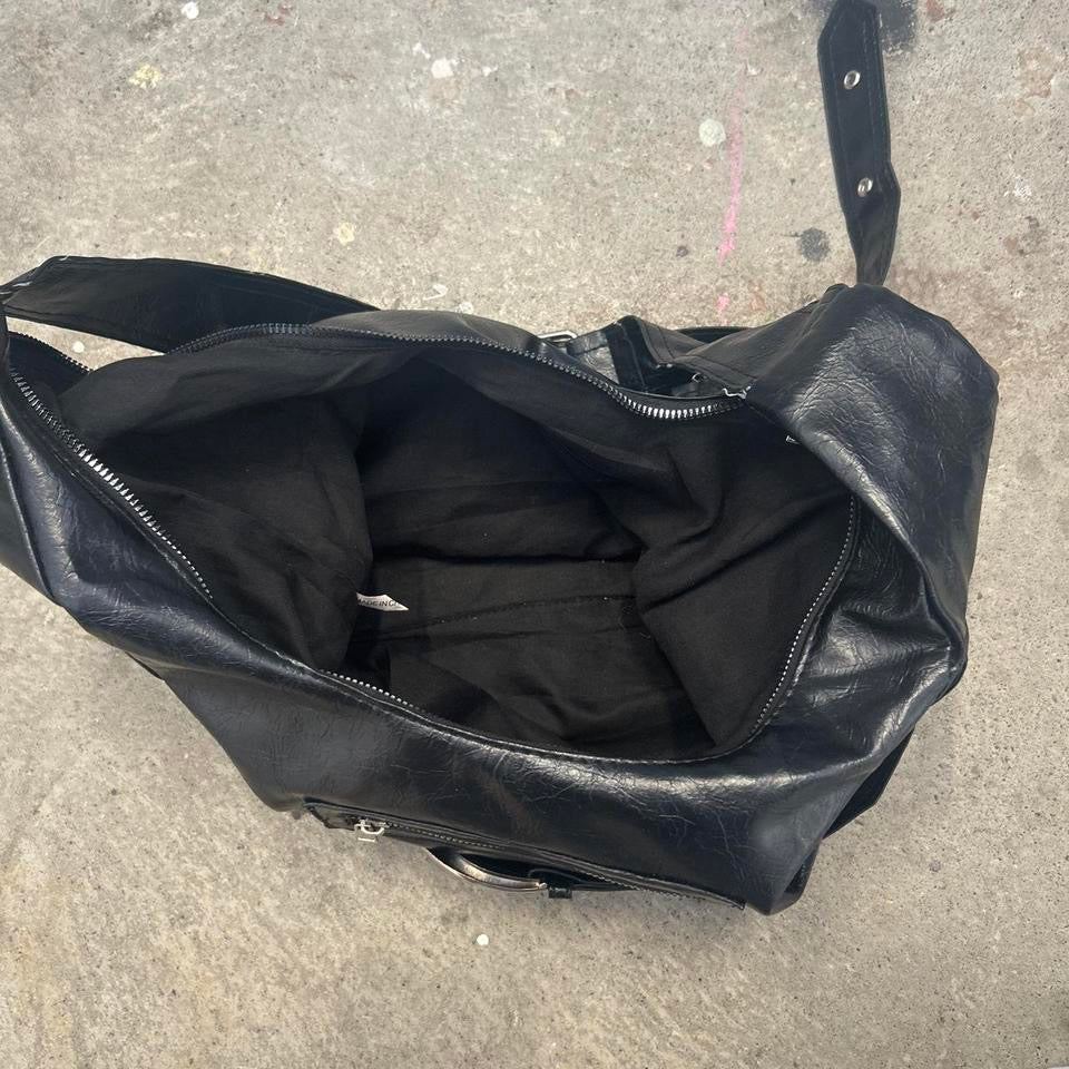 black faux leather oversized belt shoulder bag