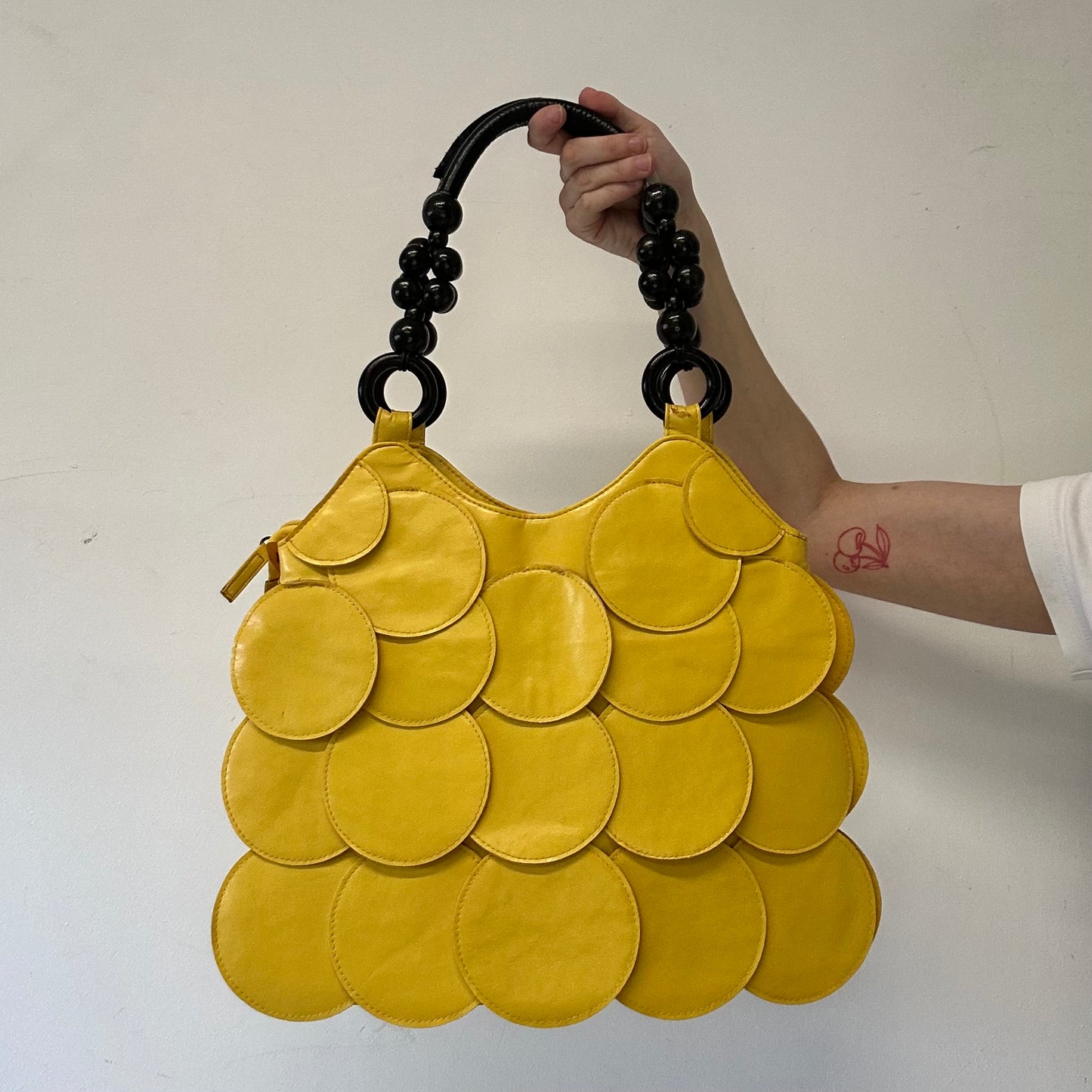 yellow faux leather disc beaded shoulder bag