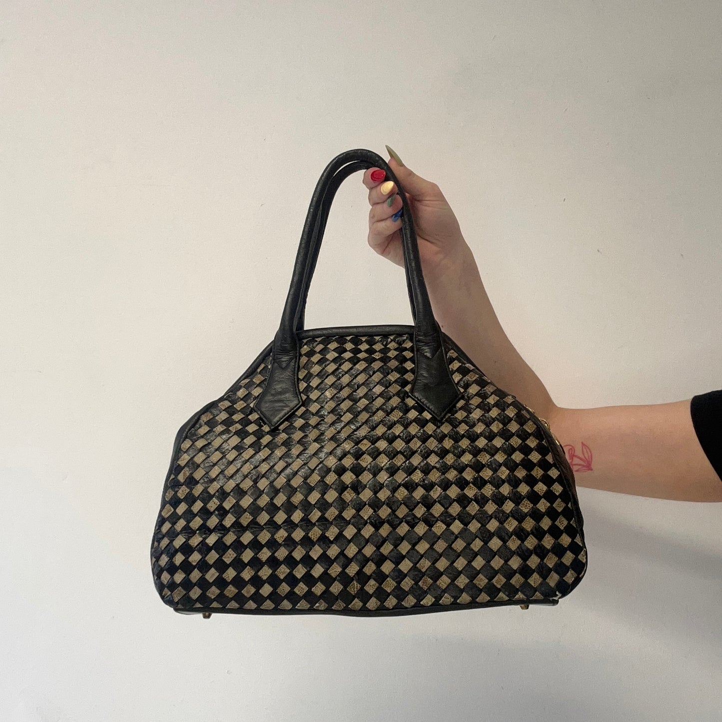 black and tanned woven leather shoulder bag