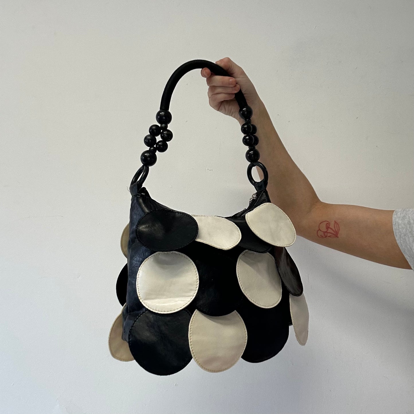 black and white faux leather disc beaded shoulder bag