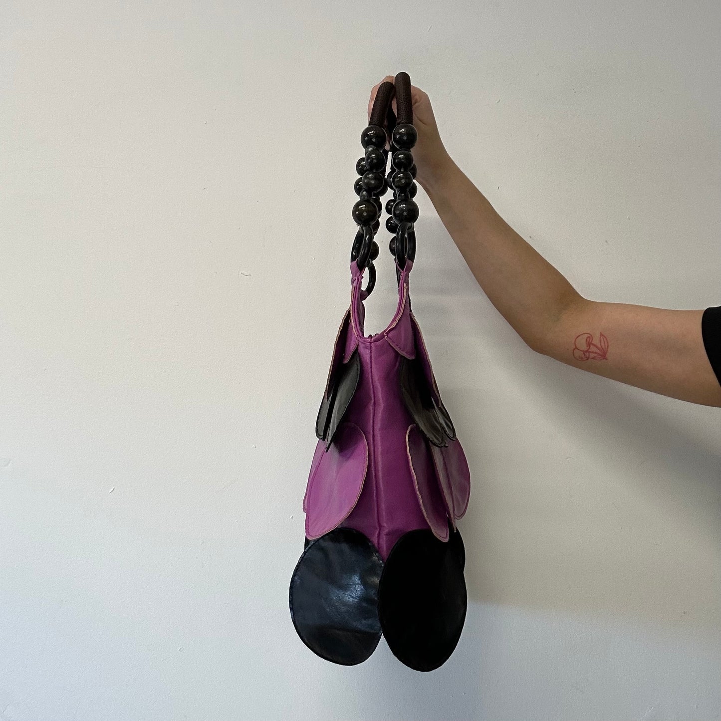 pink and black faux leather disc beaded shoulder bag