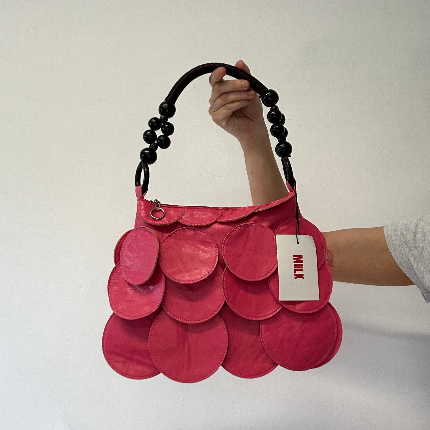 pink faux leather disc beaded shoulder bag