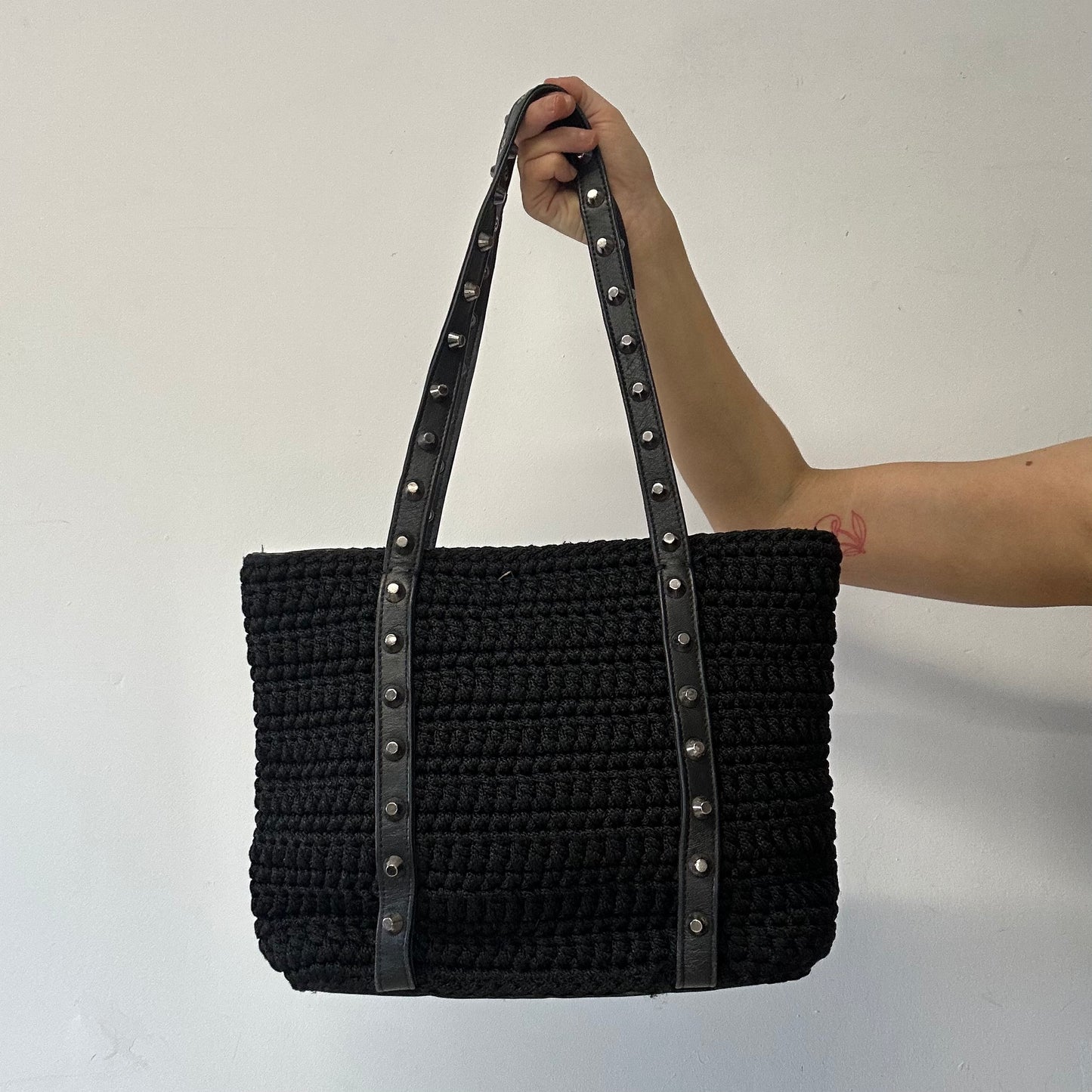 black studded genuine leather woven shoulder bag