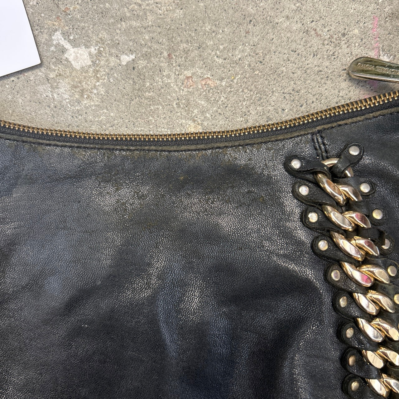 black genuine leather studded half crescent shoulder bag