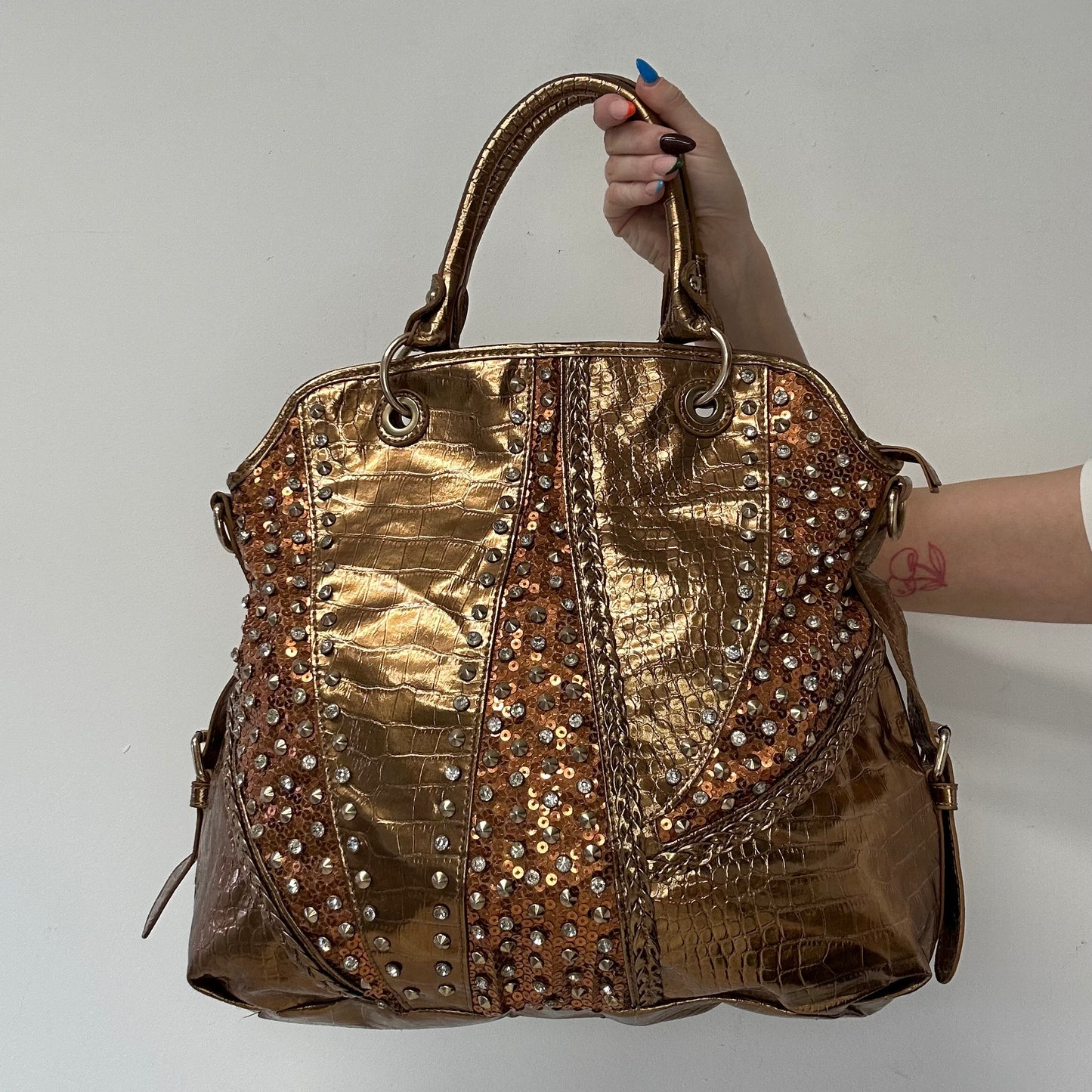 gold and bronze studded croc effect hand bag