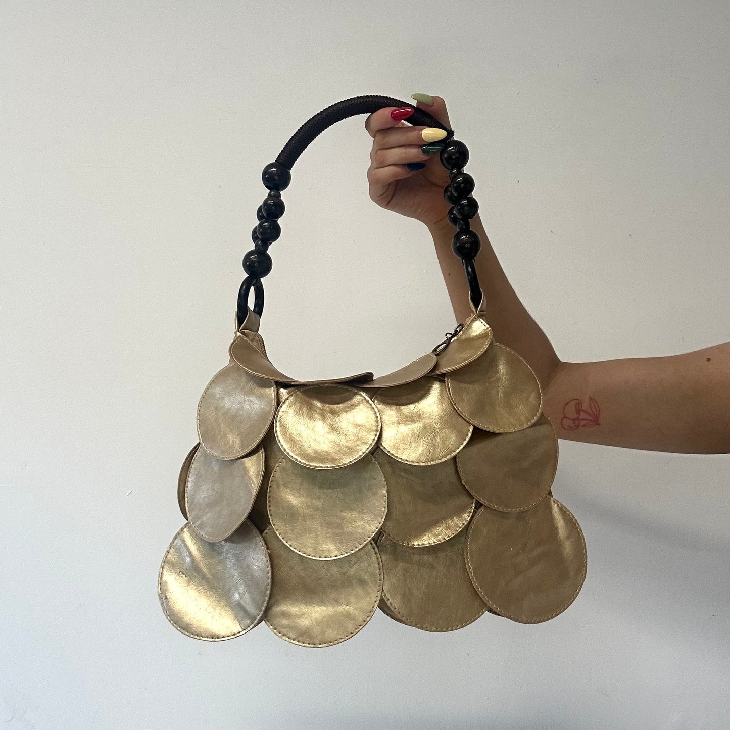 gold faux leather disc beaded shoulder bag
