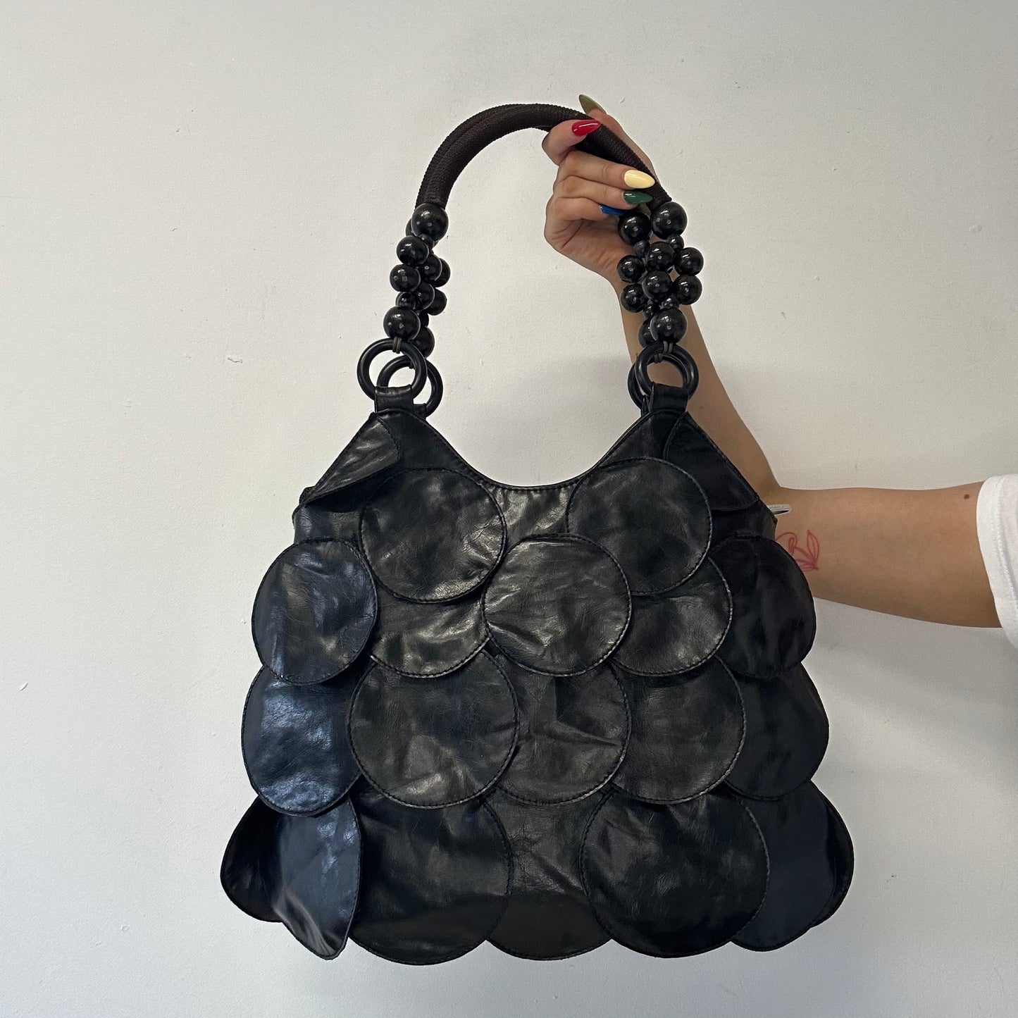black faux leather disc beaded shoulder bag