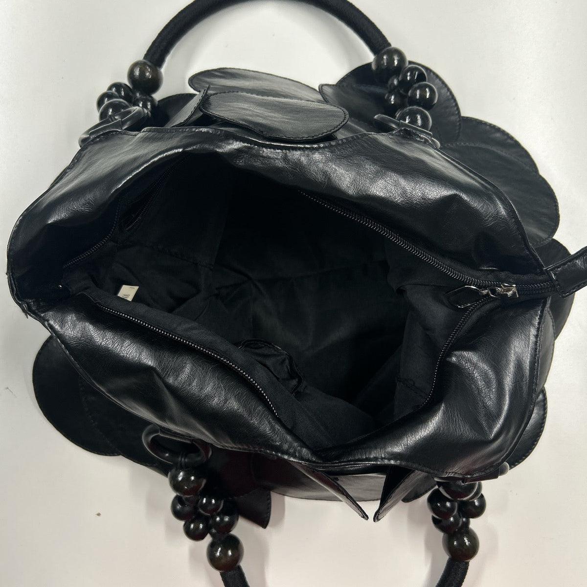 black faux leather disc beaded shoulder bag