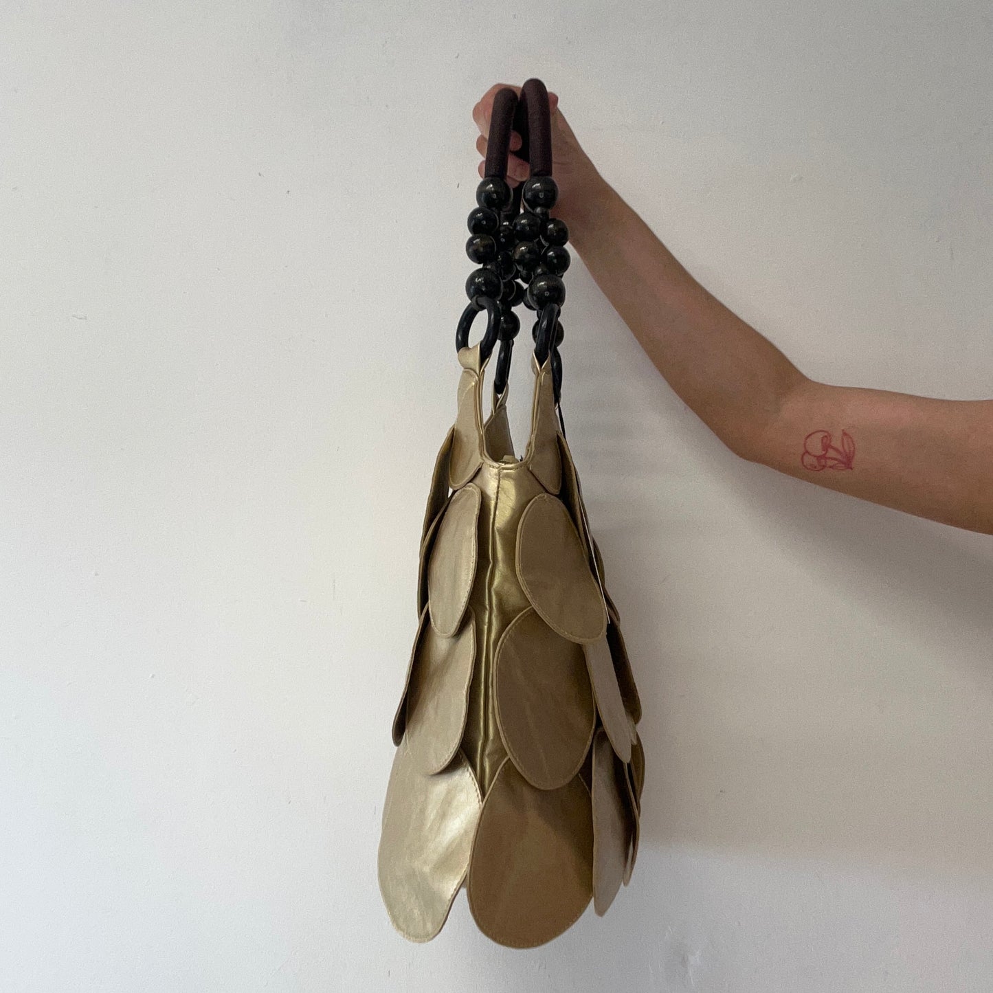 gold faux leather disc beaded shoulder bag