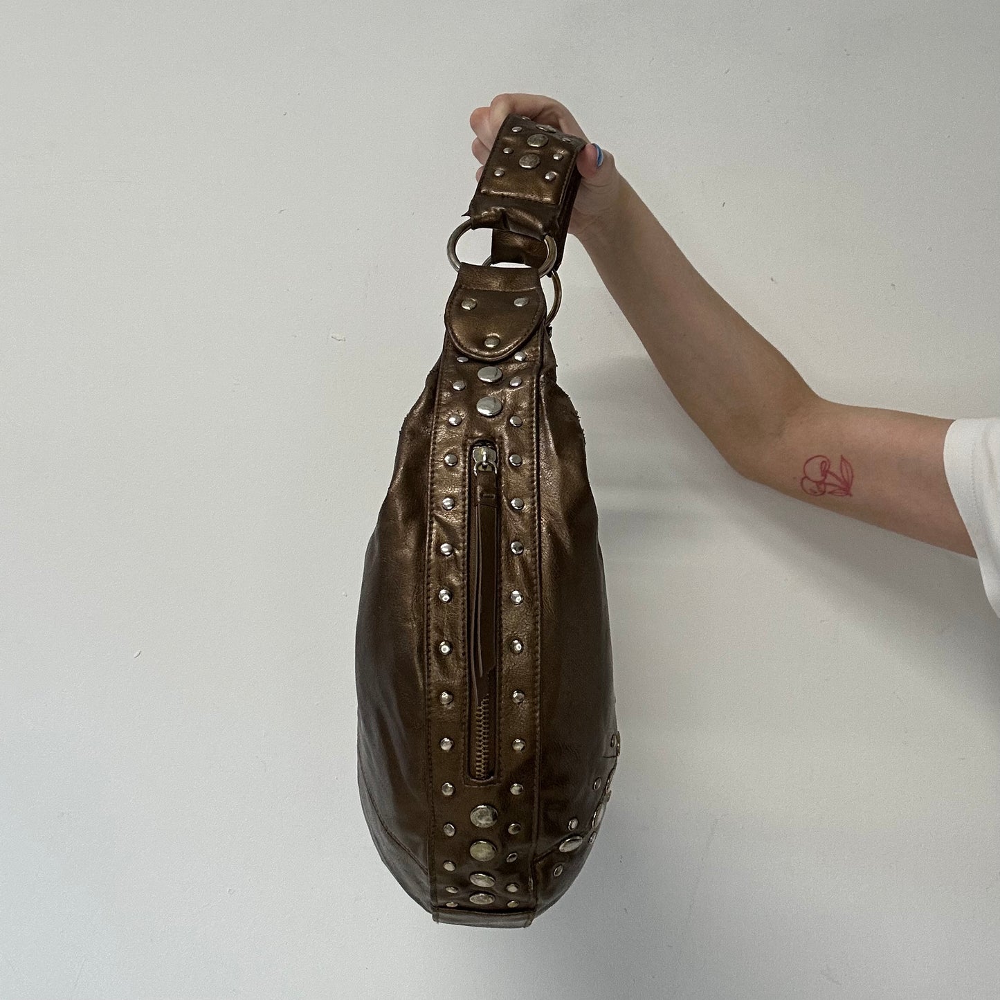 brown studded faux leather half crescent shoulder bag