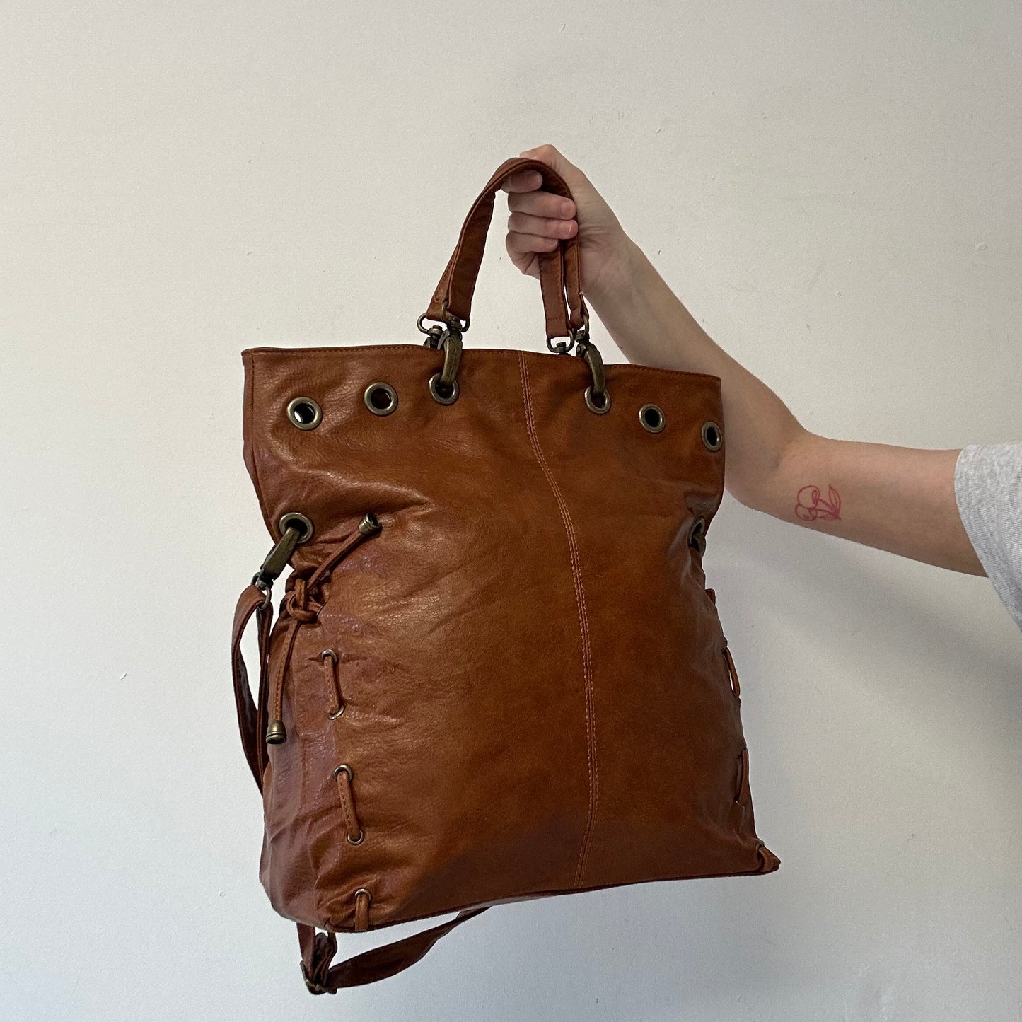 brown eyelet ruched faux leather shoulder bag