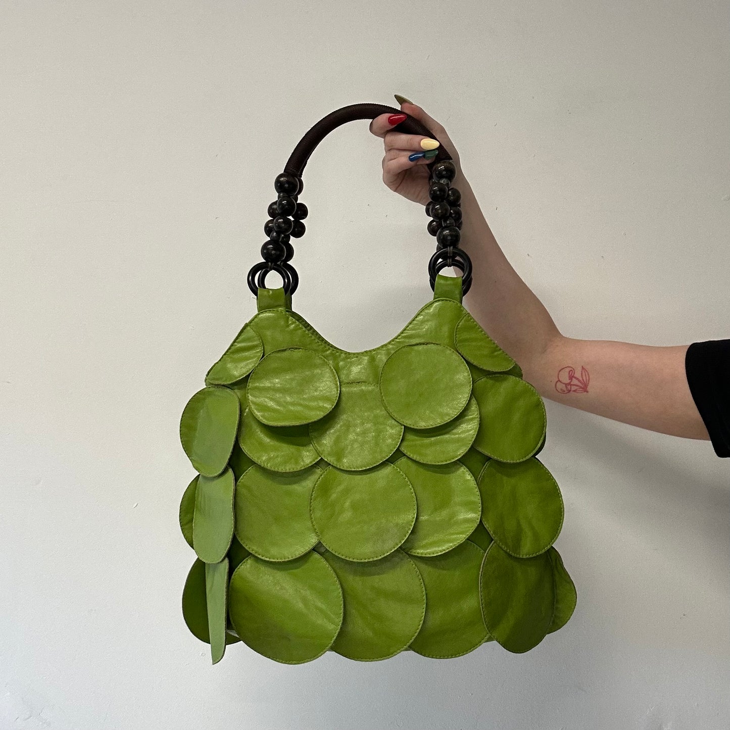 green faux leather disc beaded shoulder bag