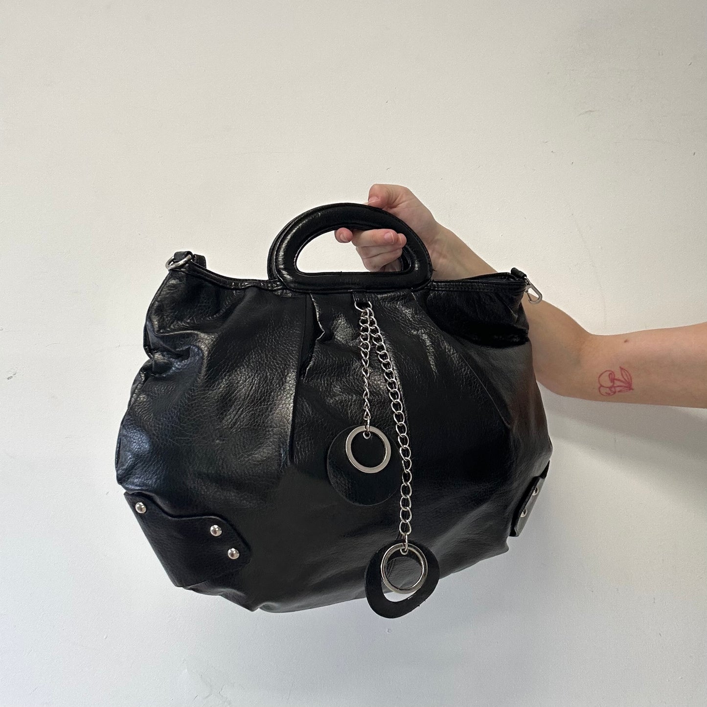 black faux leather keychain hand bag
