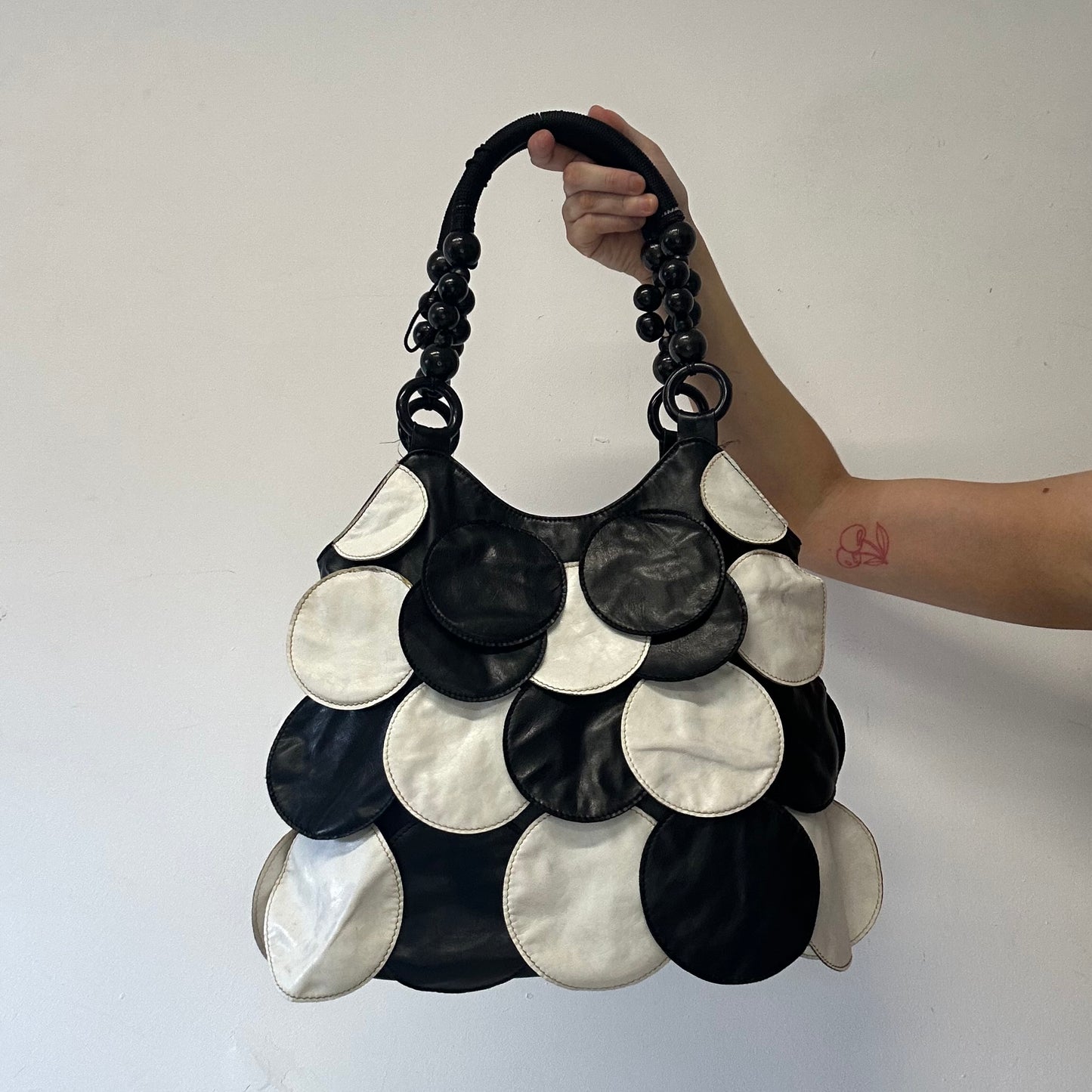 black and white faux leather disc beaded shoulder bag