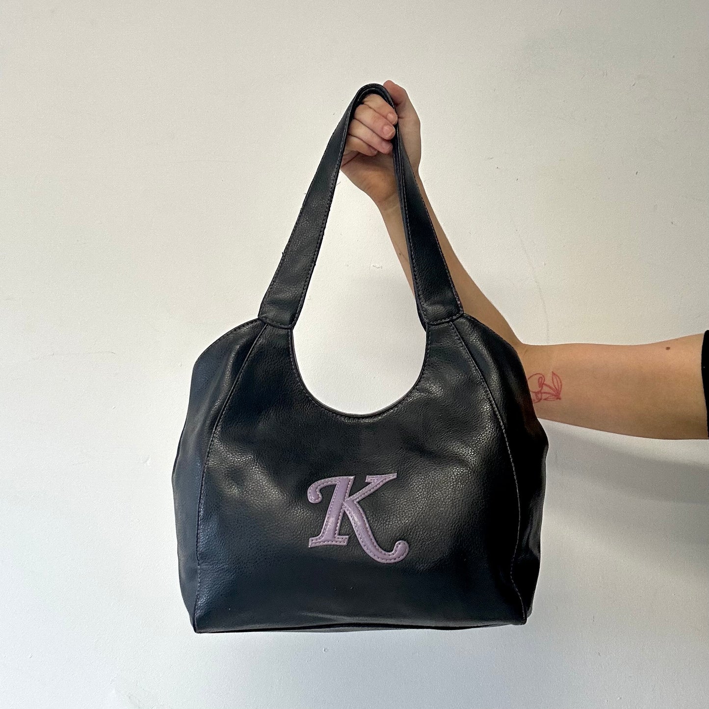 black and purple k faux leather shoulder bag