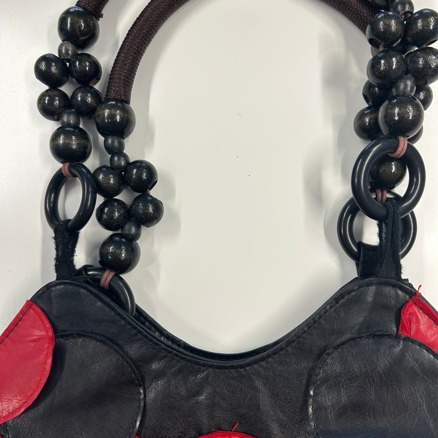 black and red faux leather disc beaded shoulder bag