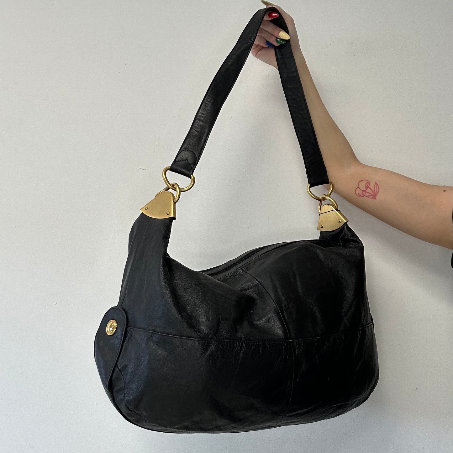 black faux leather large sling bag