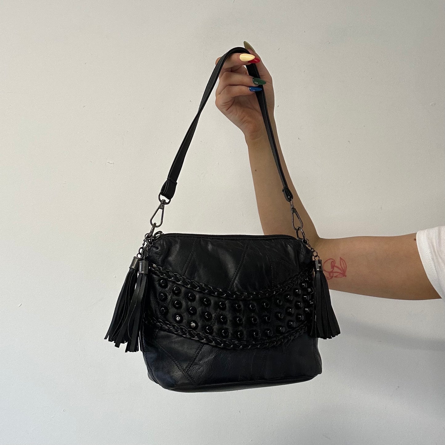 black faux leather studded shoulder bag