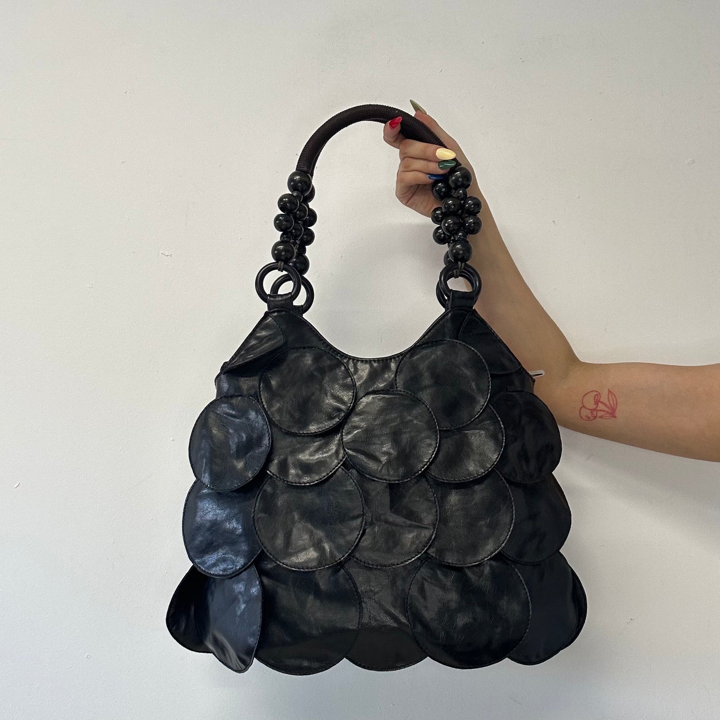 black faux leather disc beaded shoulder bag
