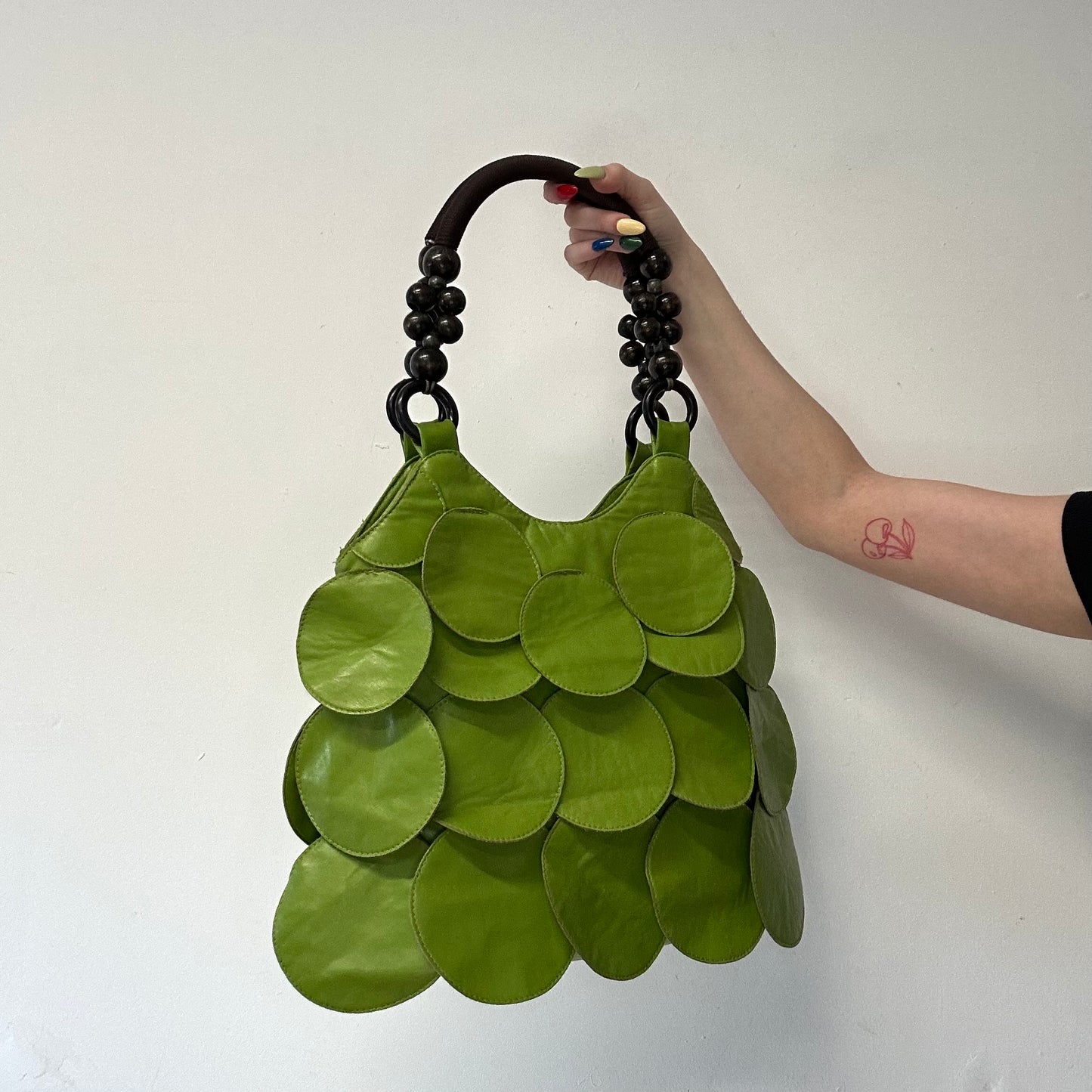 green faux leather disc beaded shoulder bag