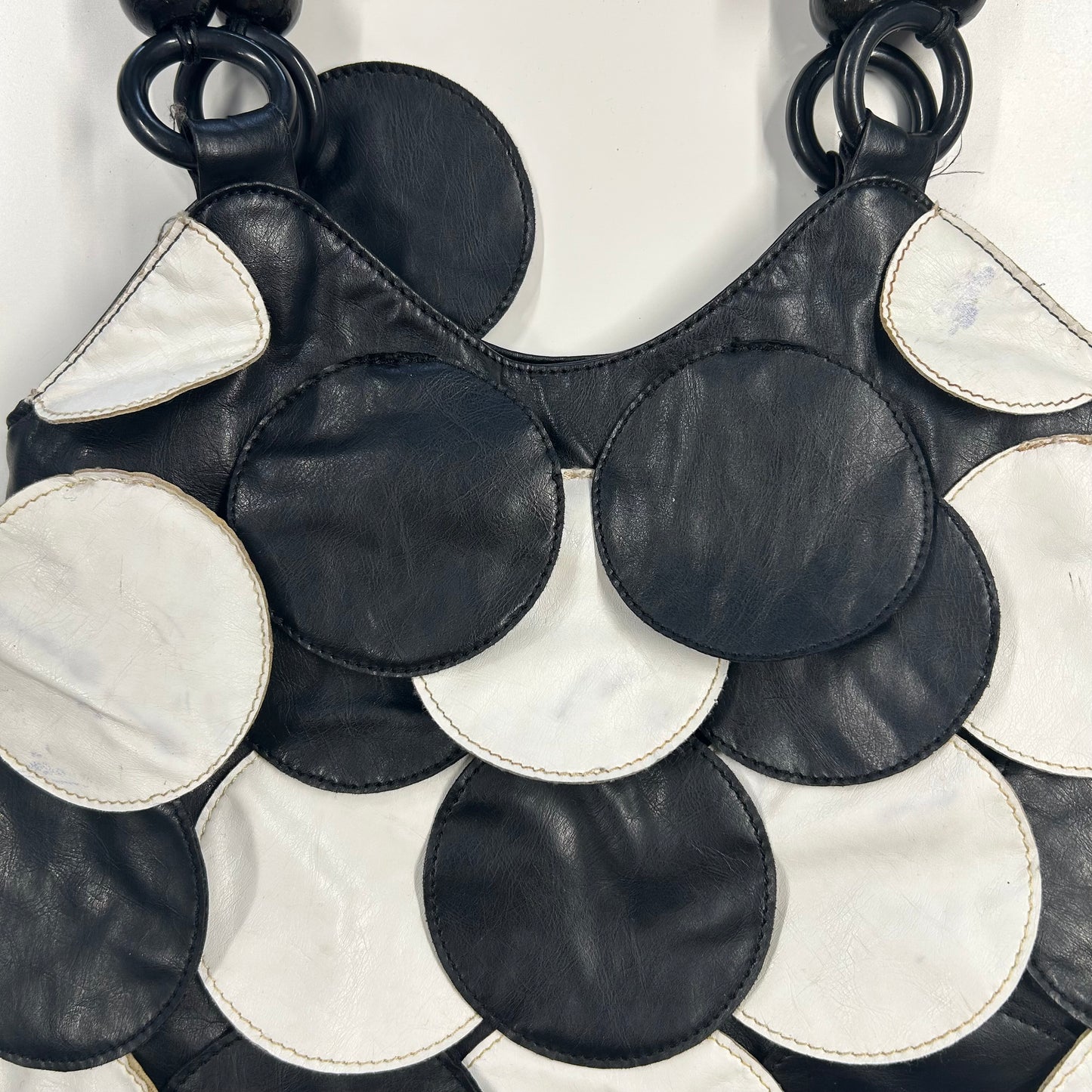 black and white faux leather disc beaded shoulder bag