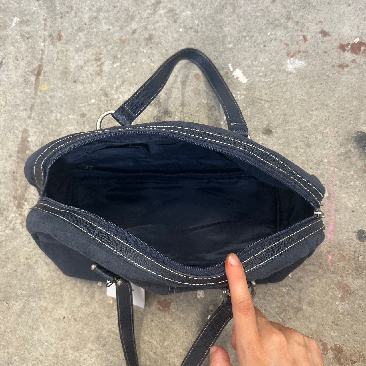 navy eyelet bowler shoulder bag