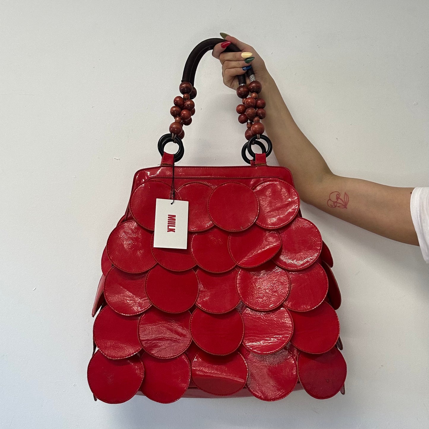 red faux leather disc beaded shoulder bag
