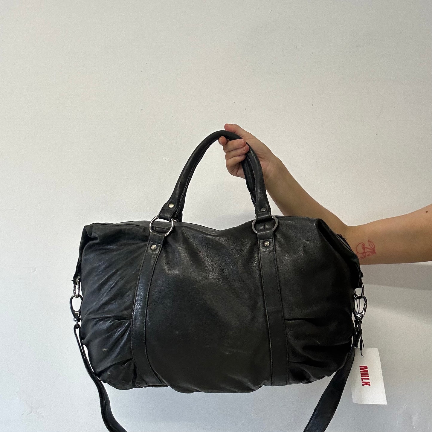 black genuine leather buckle luggage bag