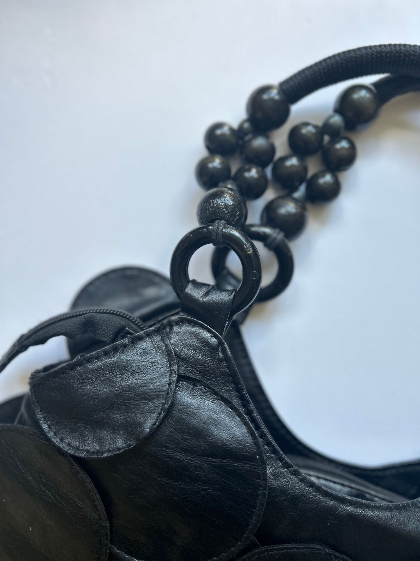 black faux leather disc beaded shoulder bag