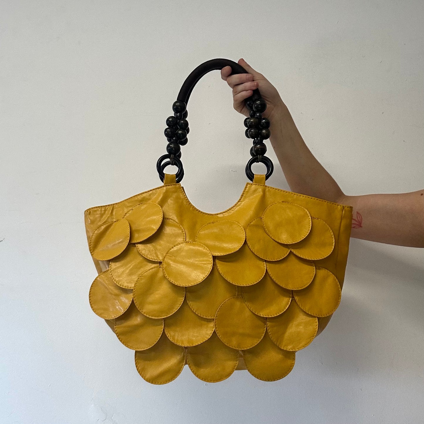 yellow faux leather disc beaded shoulder bag