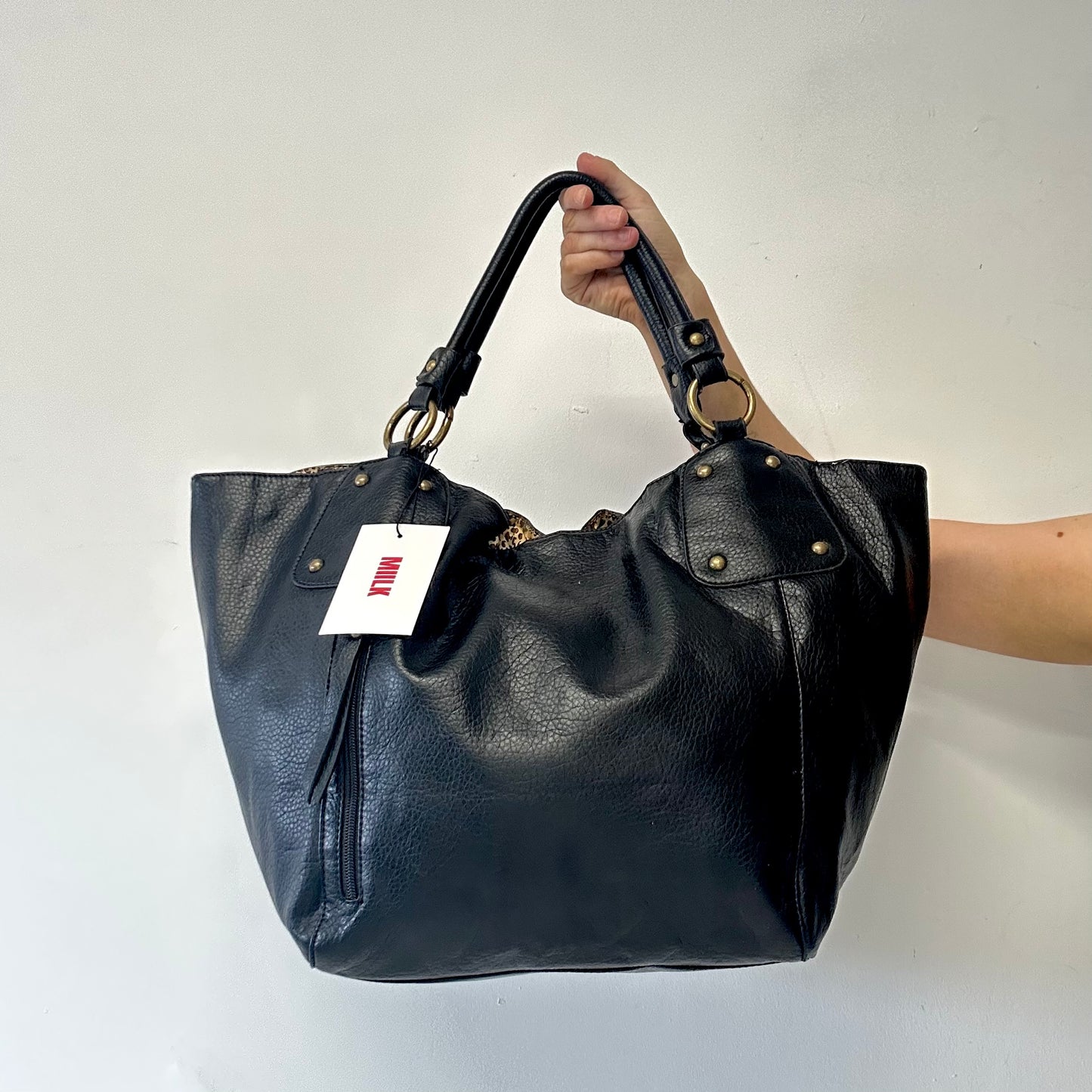 black faux leather single zip shoulder bag