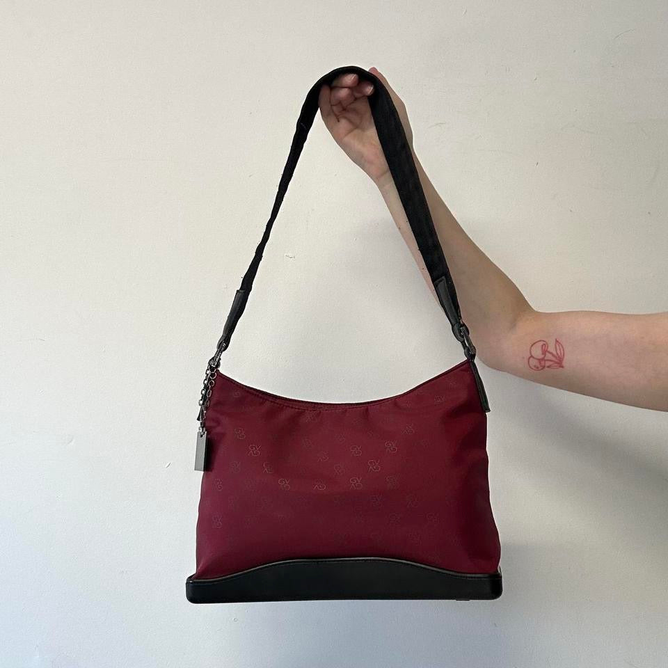 red and black canvas shoulder bag