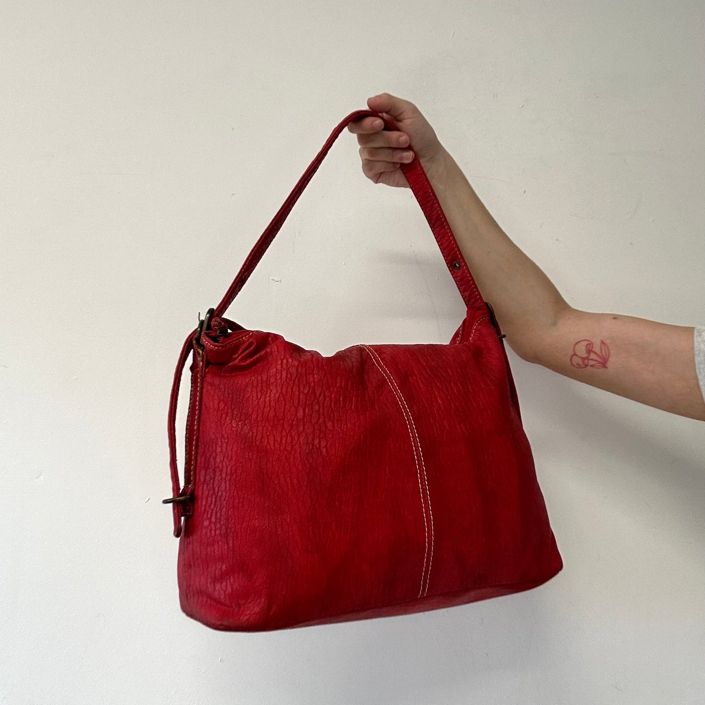 red faux leather shoulder bag