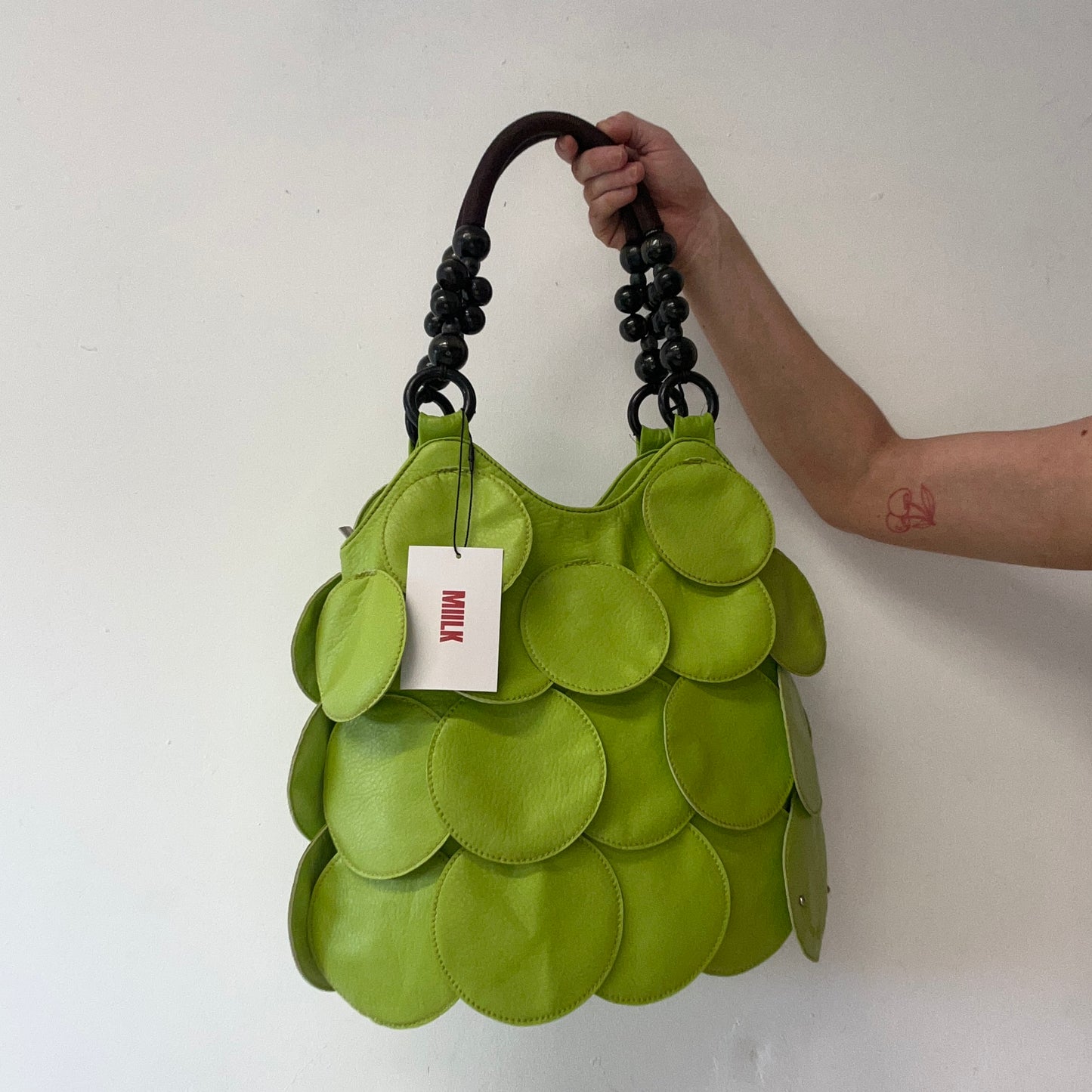green faux leather disc beaded shoulder bag