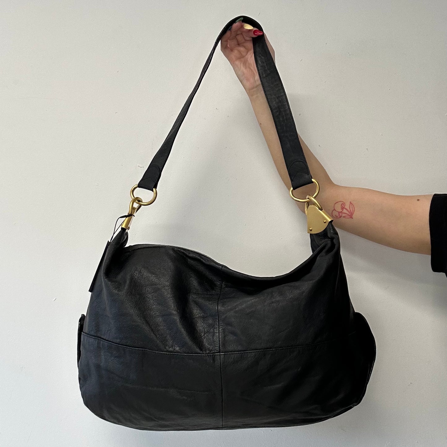 black faux leather large sling bag
