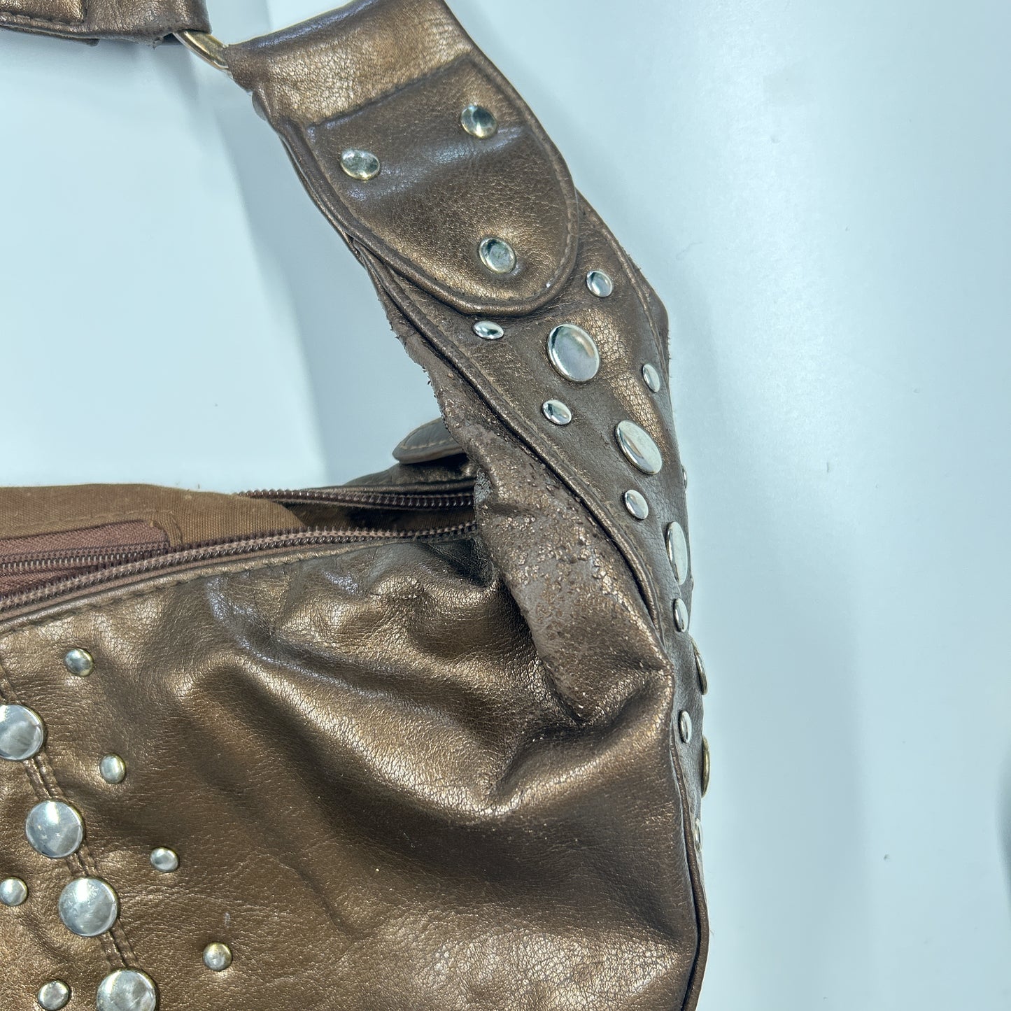 brown studded faux leather half crescent shoulder bag