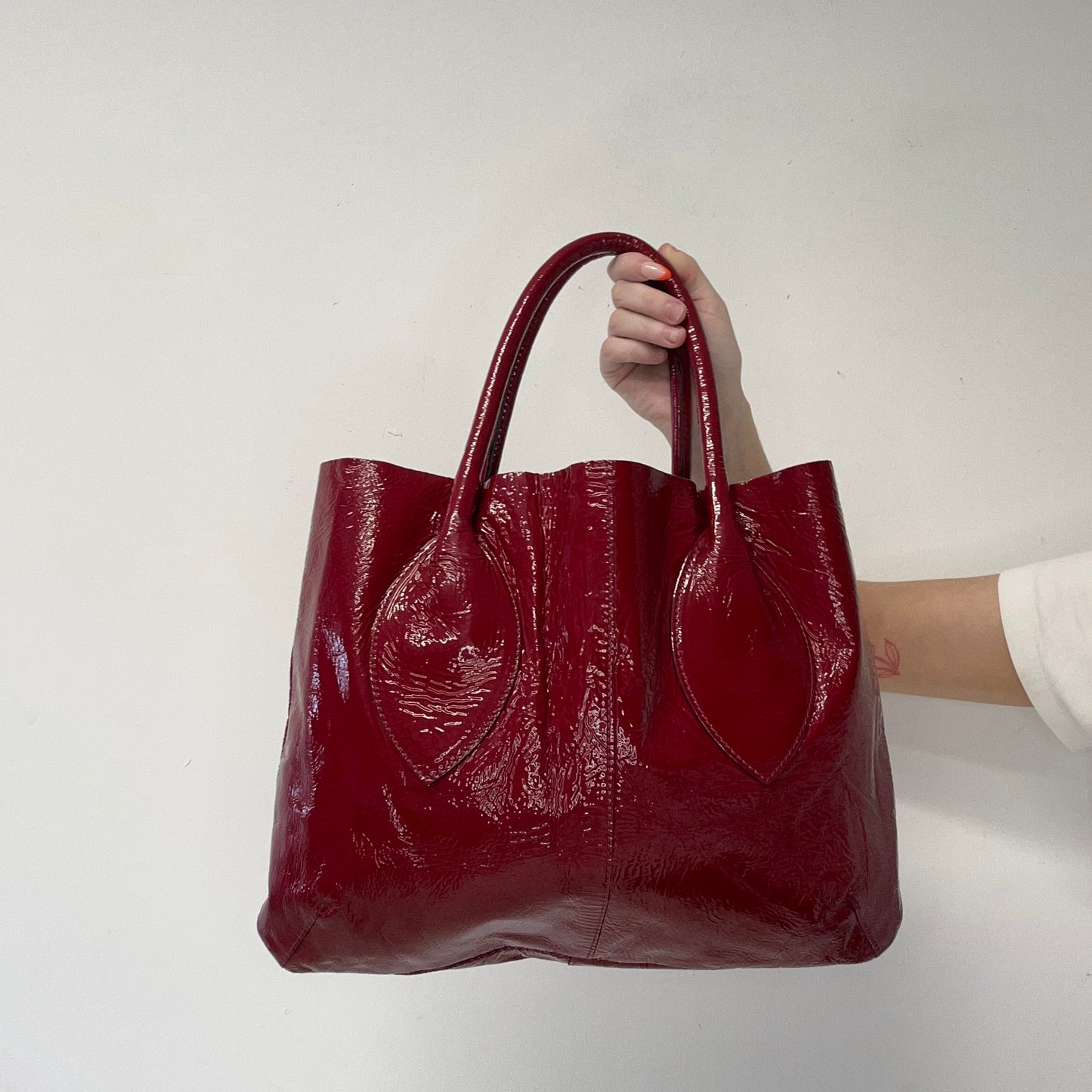 red lightweight patent shoulder bag
