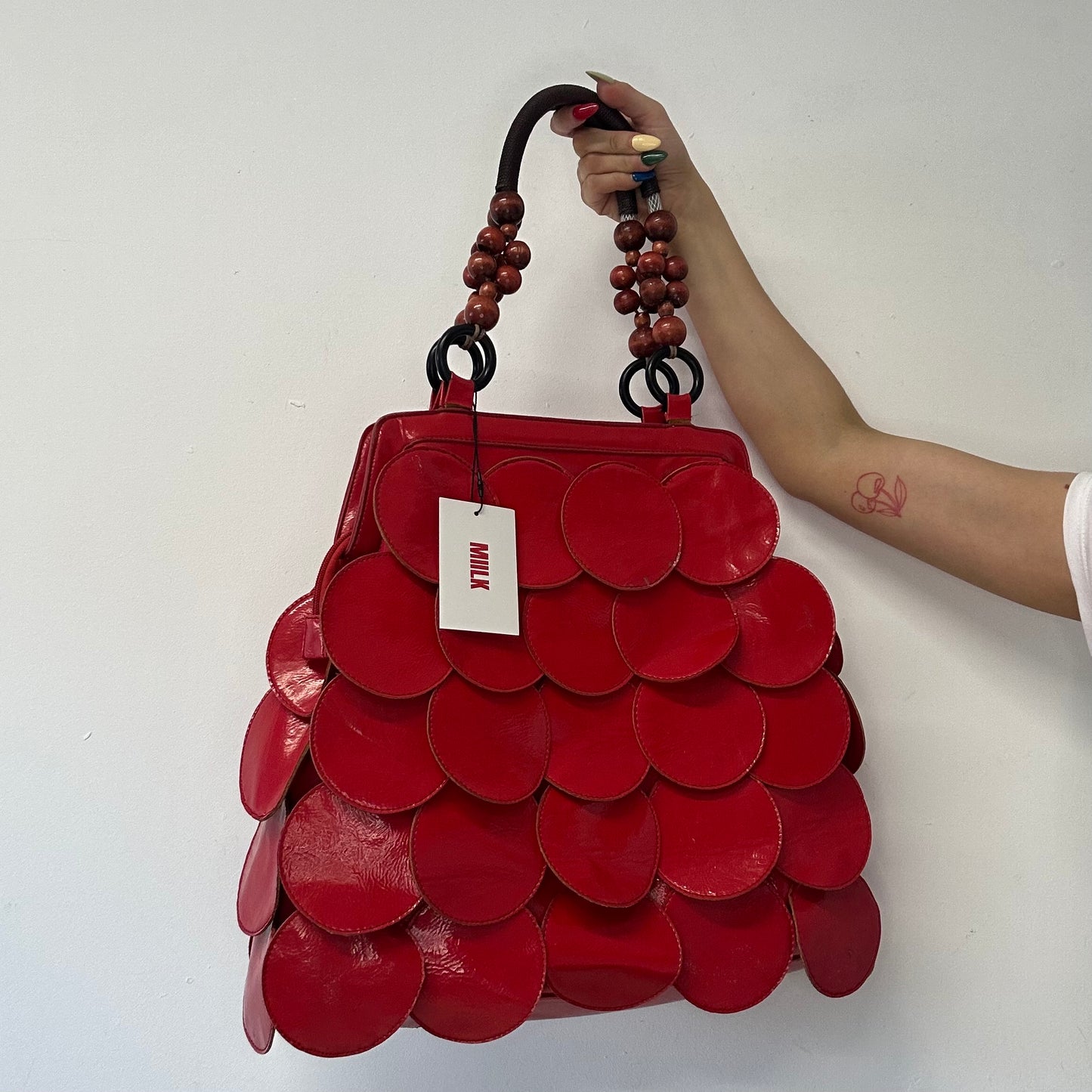 red faux leather disc beaded shoulder bag