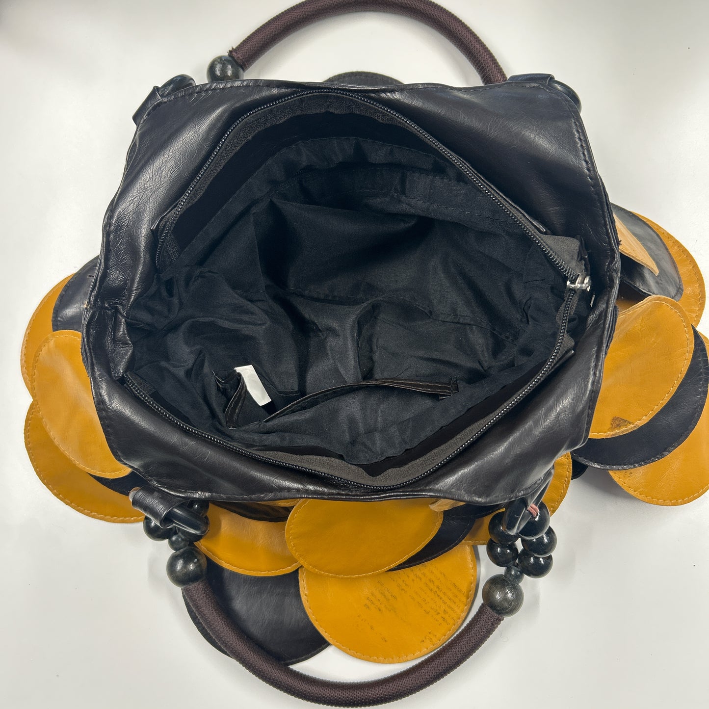 yellow and black faux leather disc beaded shoulder bag