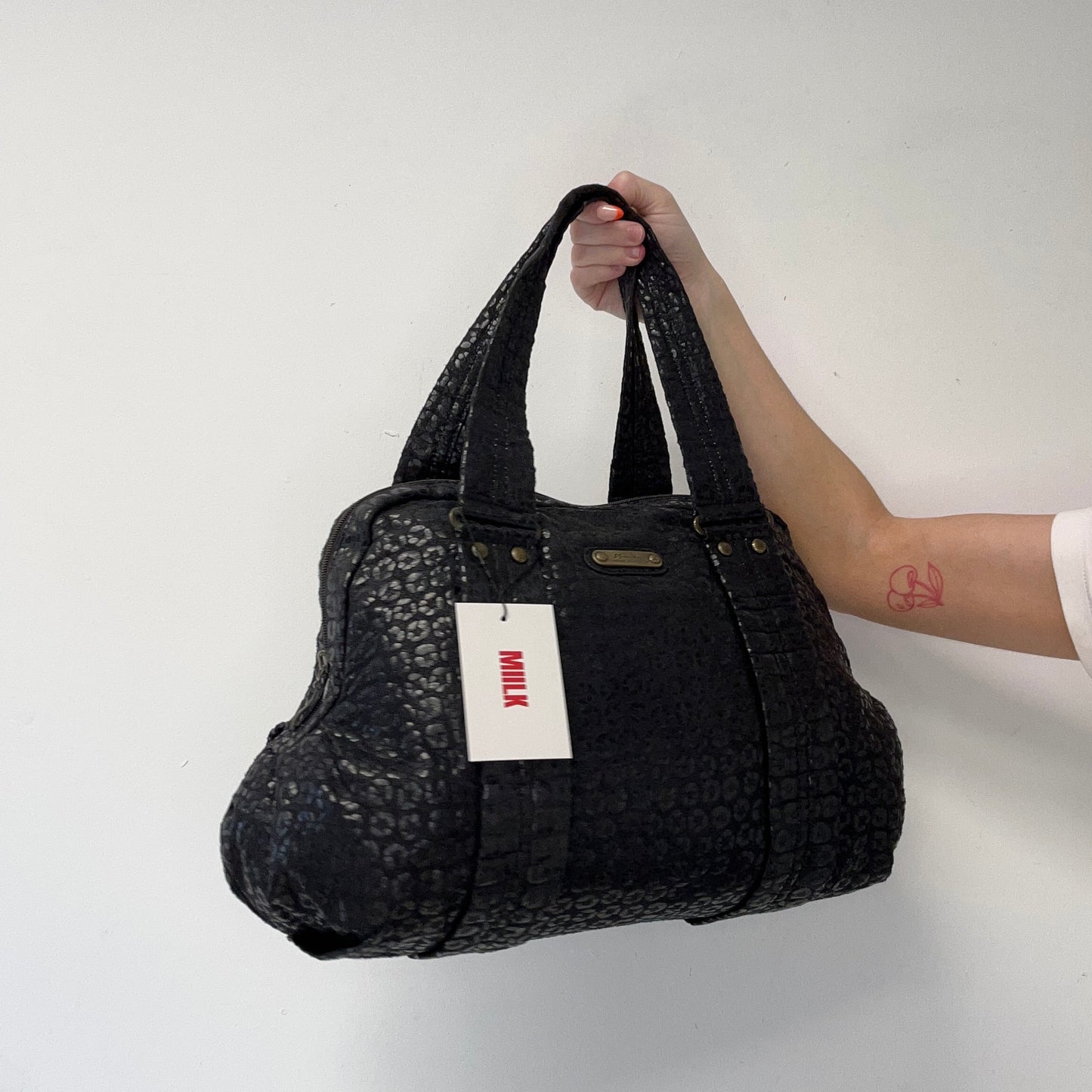 black leopard patterned shoulder bag