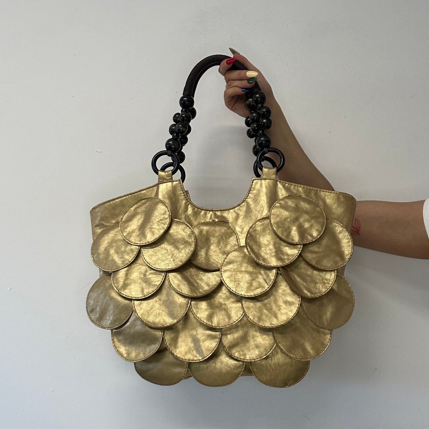 gold faux leather disc beaded shoulder bag