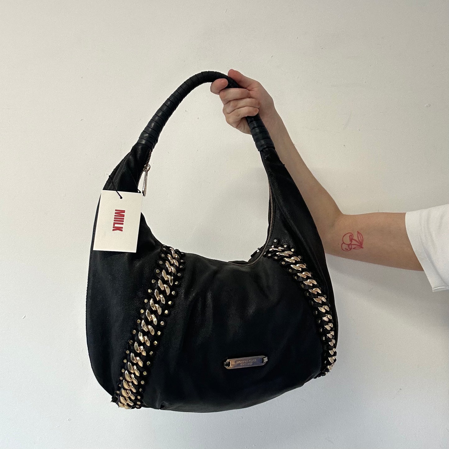 black genuine leather studded half crescent shoulder bag
